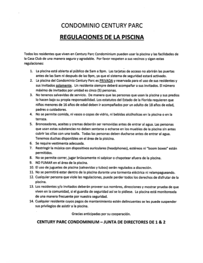Note showing the community's pool regulations in Spanish