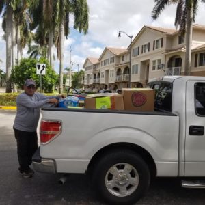 Pick-up Car Filled With Relief Boxes